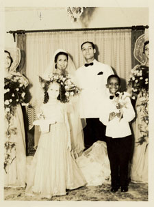 The Berrys on their wedding day. A black and white photo of the bride, groom, ring bearer, flower girl and two bridesmaids