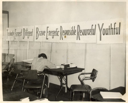 Photo of banner that has Ted Berry and the words "Earnest," "Diligent," "Brave", "Energetic", "Responsible", "Resourceful", "Youthful"