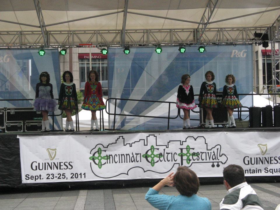 “Cincinnati Celtic Festival 2012” This photo, taken at the Cincinnati Celtic Festival in 2012, shows the school dresses, the, the solo dresses, and the choreography costumes as well. Choreography costumes are neither school dresses nor solo dresses, and are worn when doing non-traditional Ceili/choreographed dances, and, even sometimes when doing traditional ceili dances.