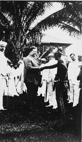 Secretary Taft shaking hands with a Moro Chieftan