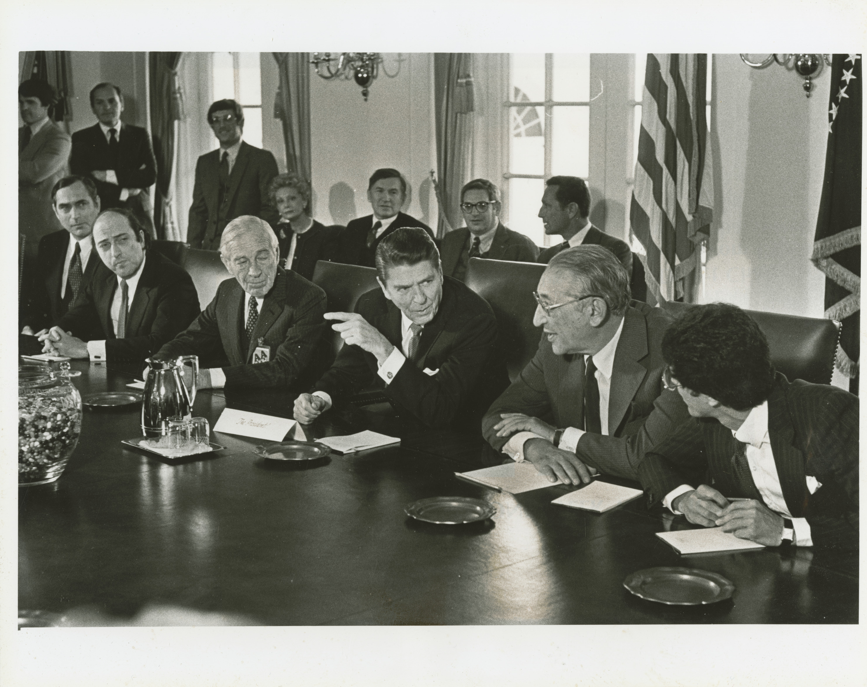 A photo of Gettler in a crowded White House meeting room with President Ronald Reagan and others.