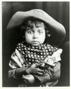 Theodore Berry as a child seating in a cowboy hat