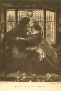 An image of a man and woman kissing while seated