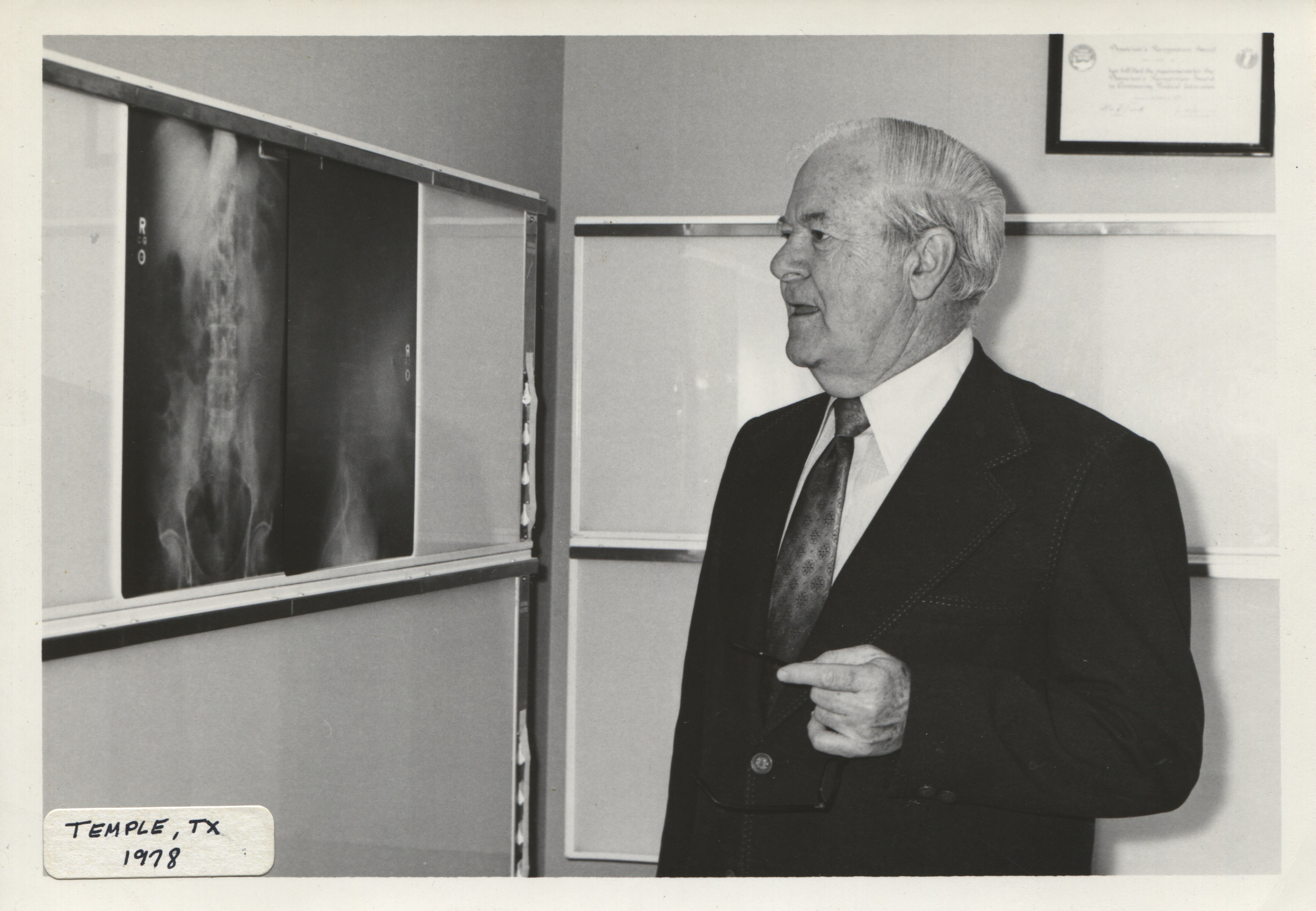 Dr. Felson standing in front of x-ray - 1978