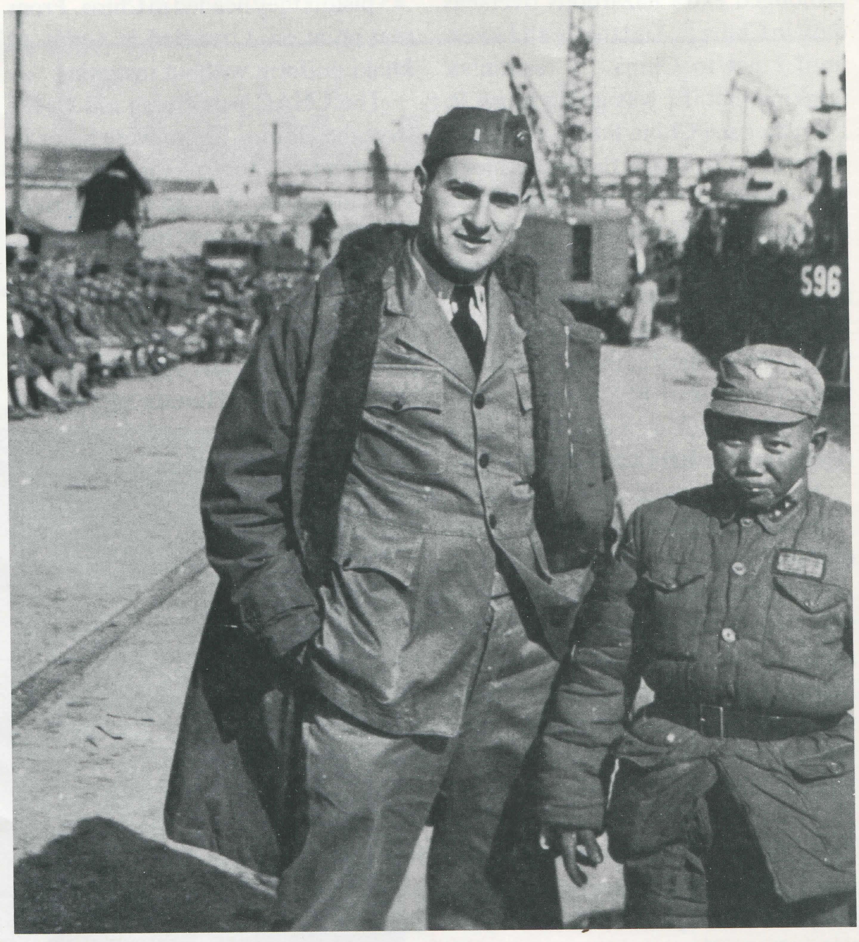 Dr. Heimlich and a Chinese soldier pose for a snapshot on the Shanghai waterfront