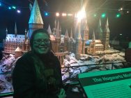 Kellie in front of a model of Hogwarts