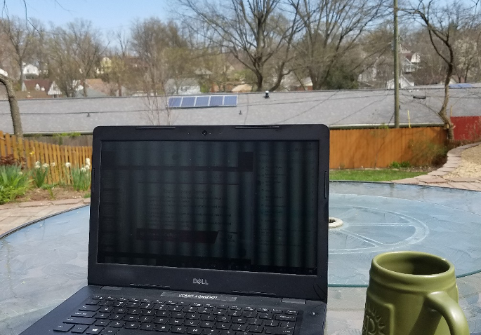 laptop on outdoor patio table