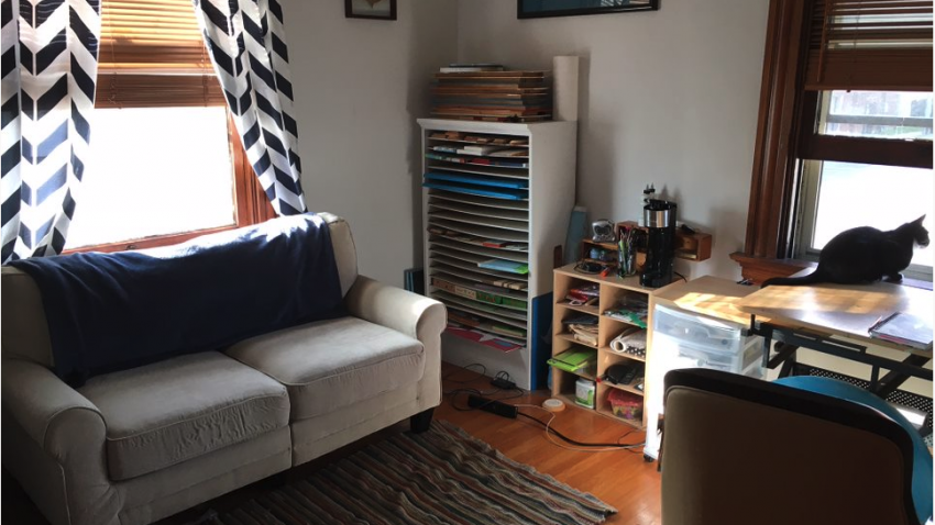 studio with couch and craft supplies