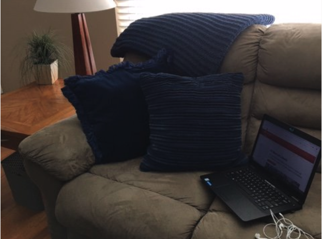 laptop on couch with pillows