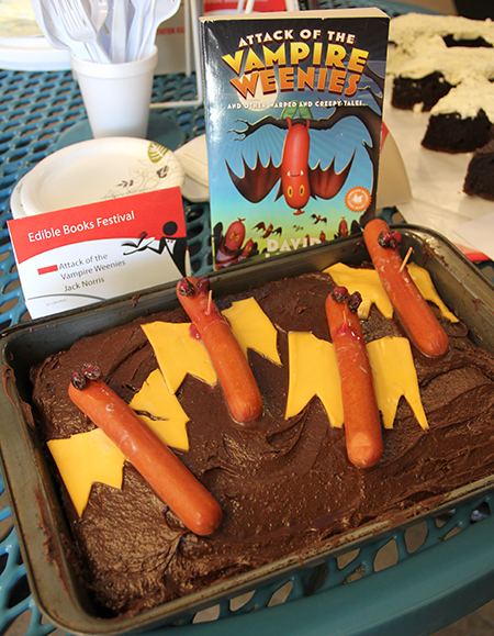 edible book with hotdogs and cake