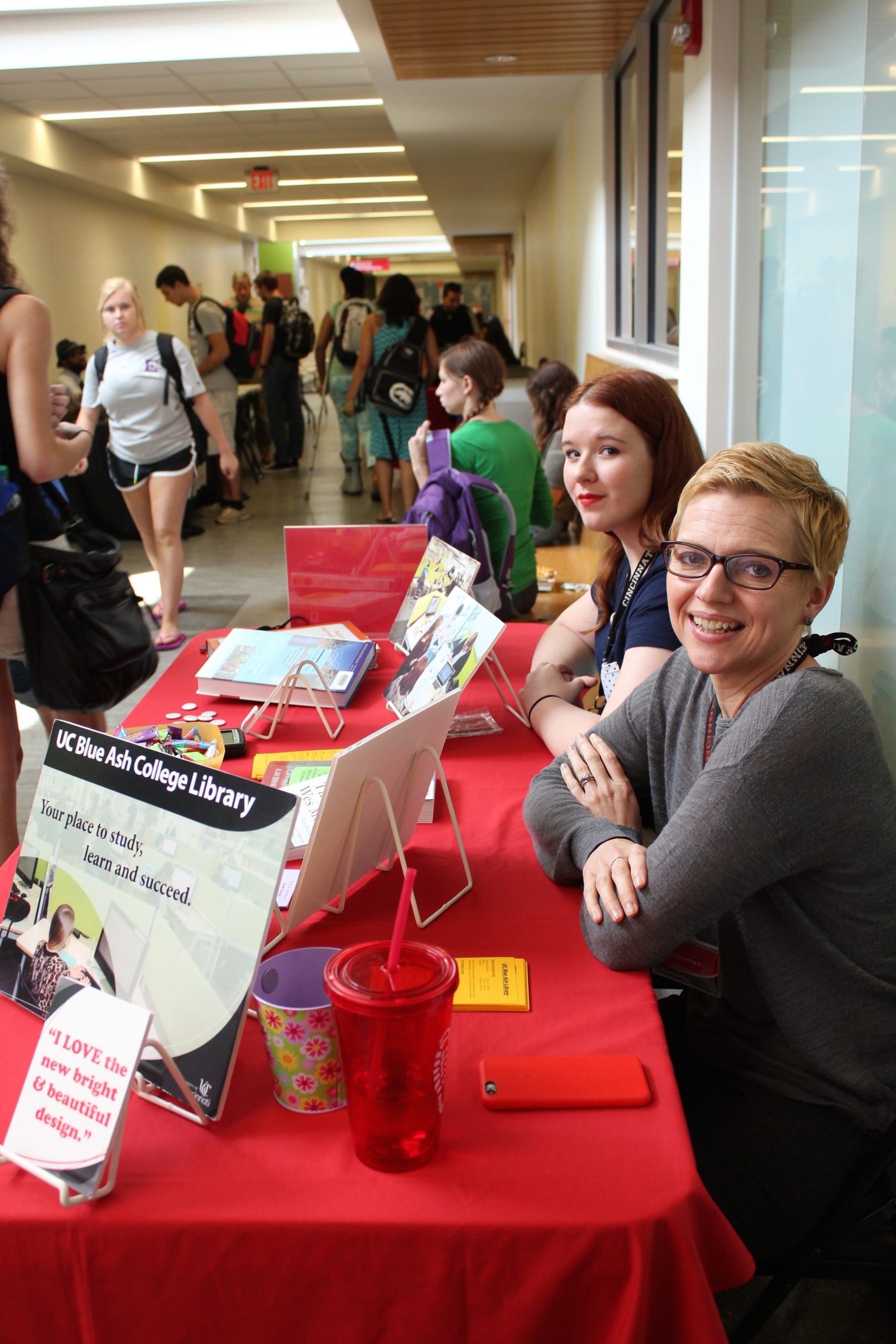 Heather Maloney and Student Worker staffing table