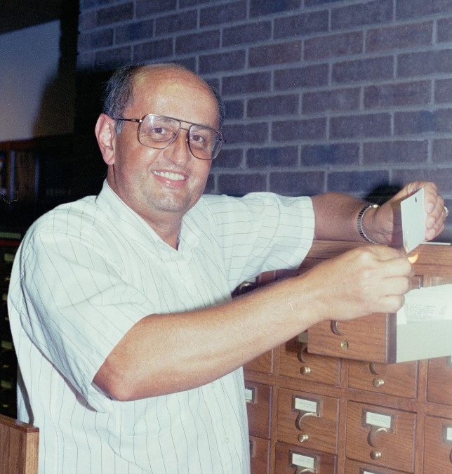 Fred Marcotte, College Librarian, in 1989 burning card catalog