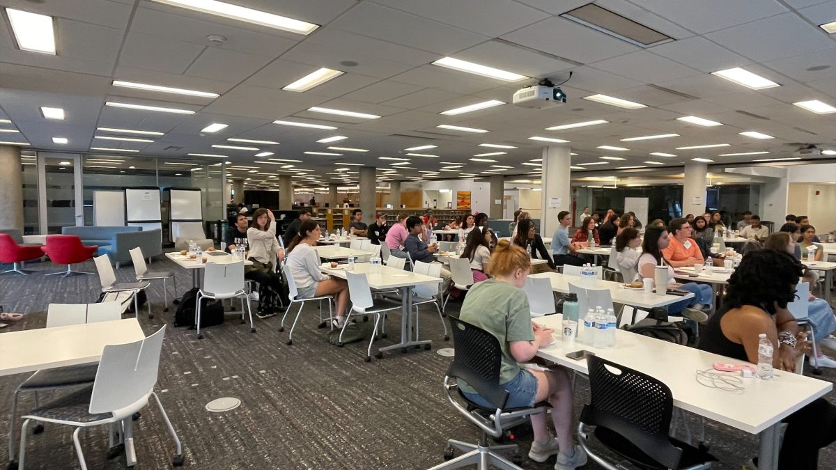 The 4th floor area of Langsam with many students sitting at the tables