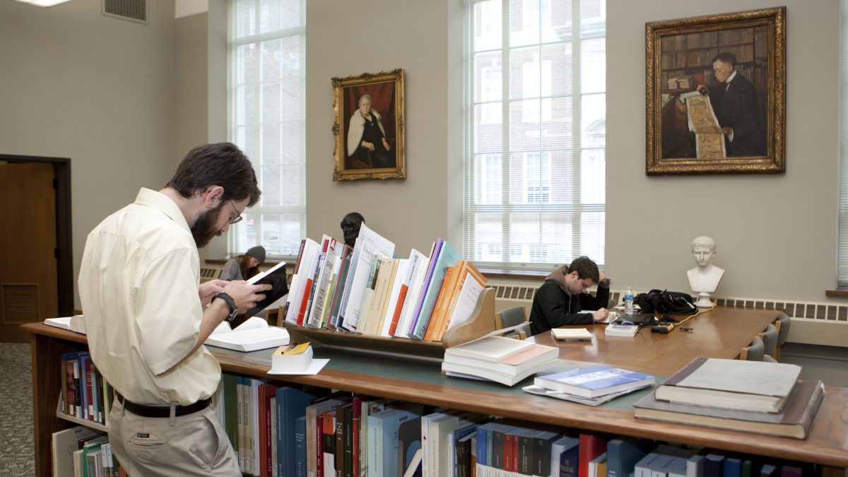 student reading books in the classics library
