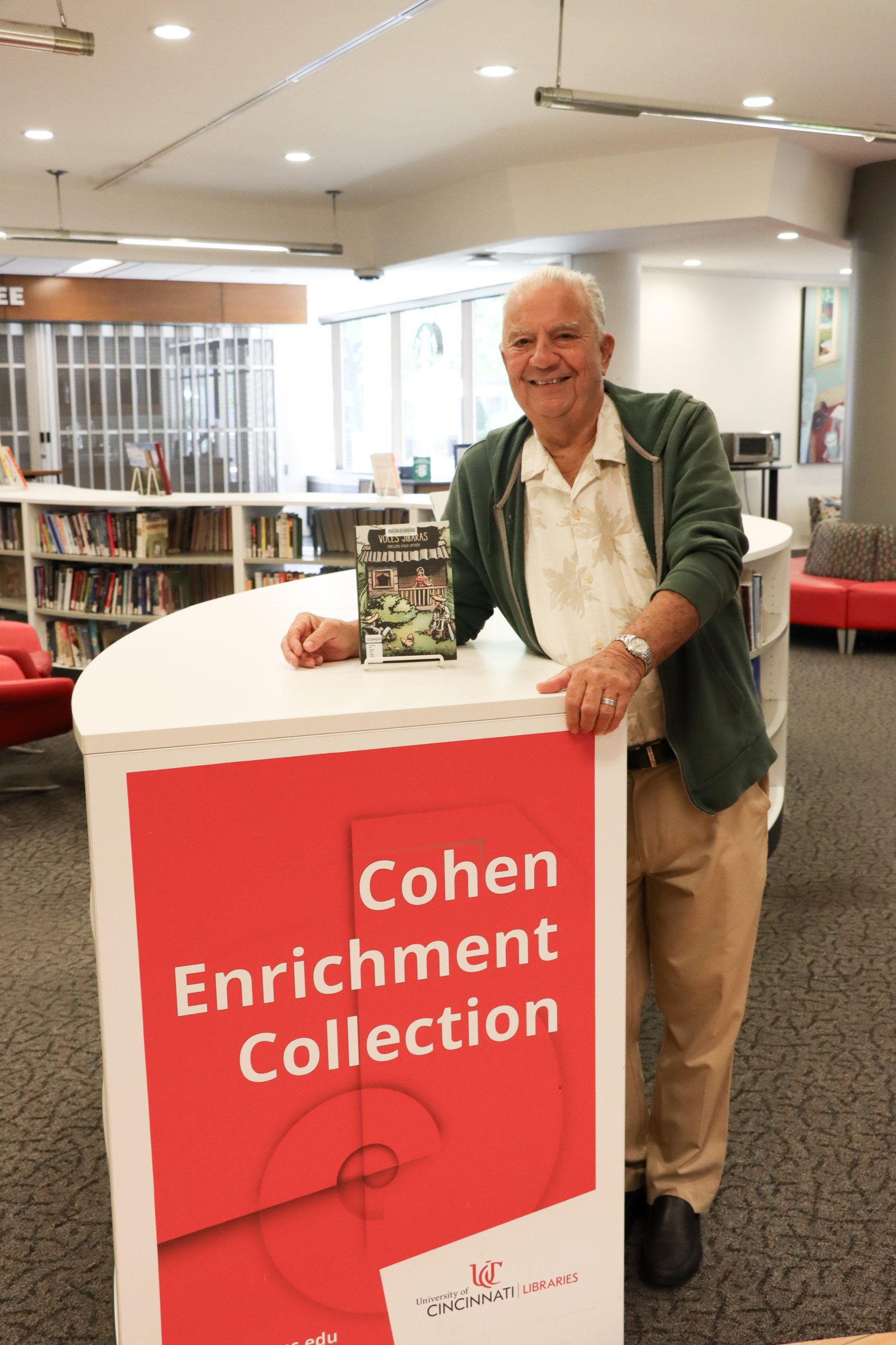 Mr. Oyola Cintrón visited the library in May to chat about Jibarísmos and see his book in its featured location.