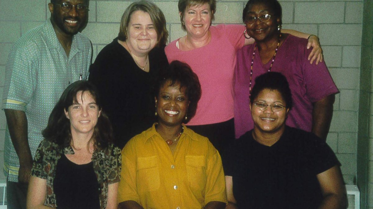 Group of seven individuals posing for camera