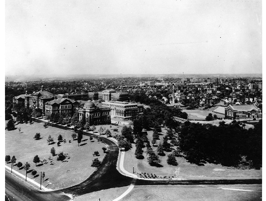 A black and white aerial photograph of a university campus.