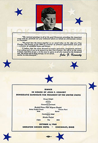 A color image of an invitation dated October 6, 1960. The invitation contains a photo of John F. Kennedy at the top with a note of greetings from John F. Kennedy. The invitation states, "Dinner in honor of John F. Kennedy, Democratic Candidate for President of the United States." The dinner took place at the Sheraton Gibson Hotel in Cincinnati.