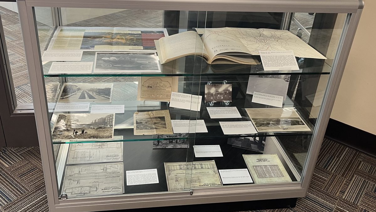 Photograph of items and labels inside of a large display case.