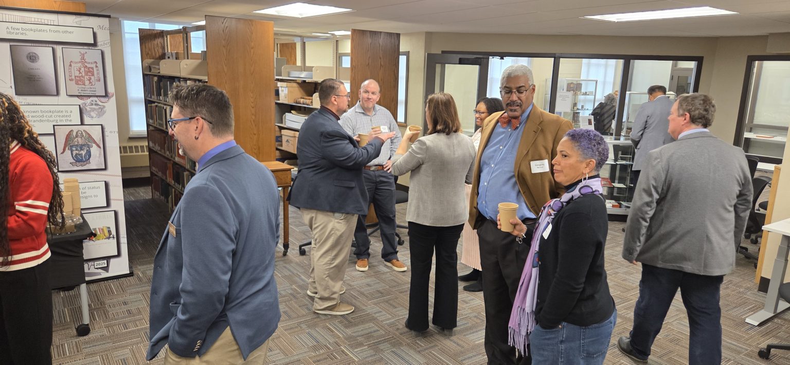 attendees at a reception in the archives and rare books library