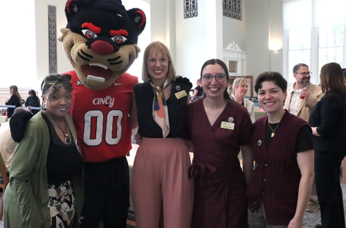 staff pose with the Bearcat