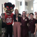 staff pose with the Bearcat
