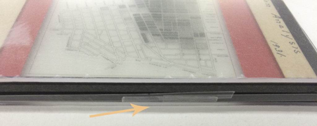 The strip of Mylar around the edges of the lantern slide will also work as a barrier between the edges of the original object and Filmoplast R adhesive.