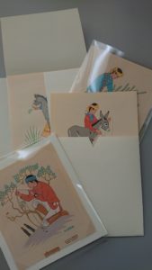 prints in mylar sleeves and backing paper