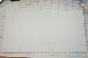 E flute board marked with score and cut lines.