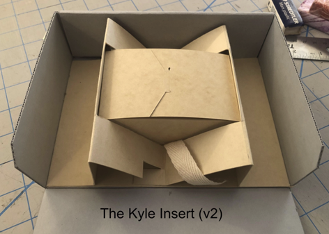 An enclosure with the Kyle Insert.  The insert is a sling like structure that secures a small tux box.  The image is clickable leading to a video documenting the creation of the insert.