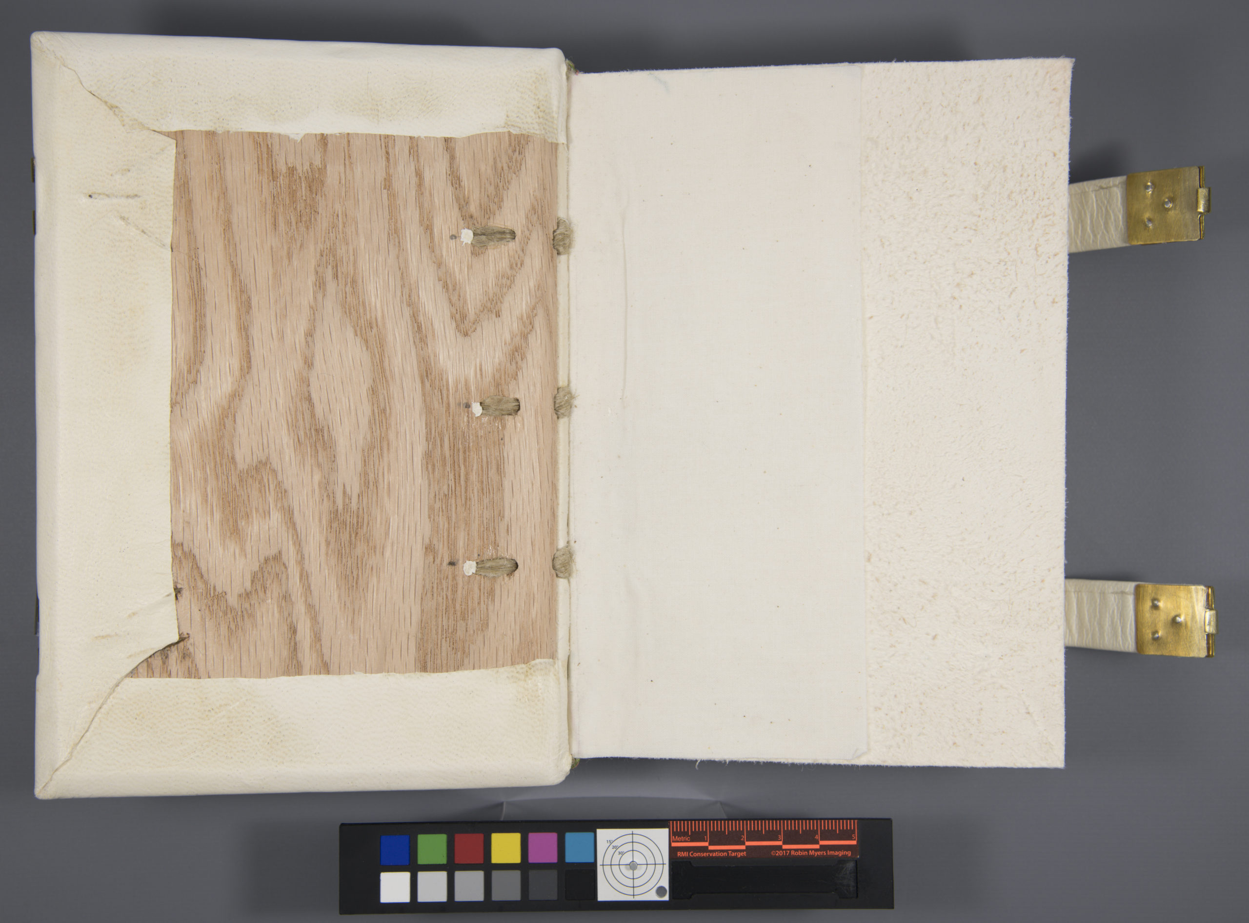 Image showing the interior of the upper board with the pastedown not attached and the wooden board exposed.