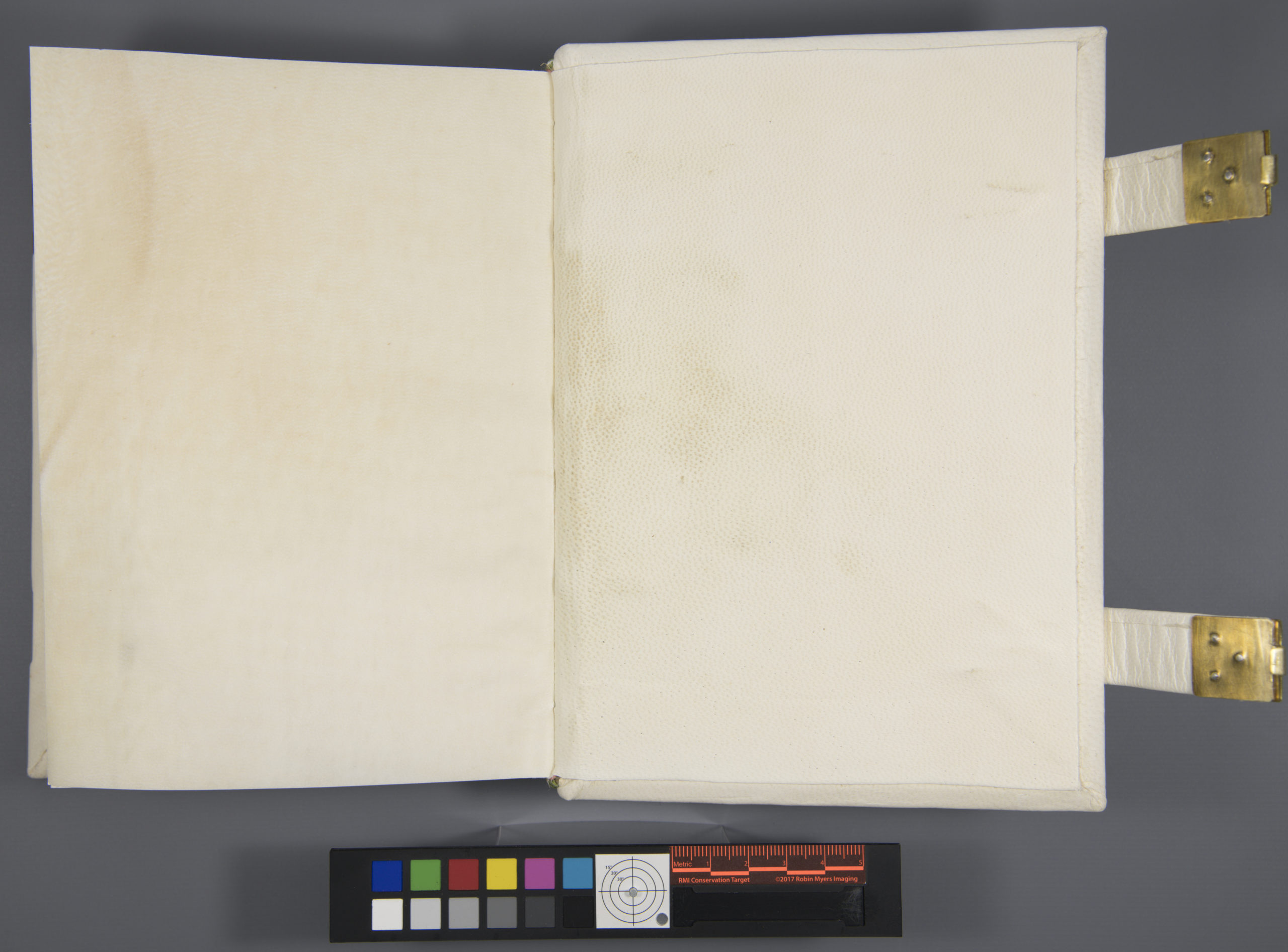 Image of the interior of the lower board, showing that the pastedown is attached.