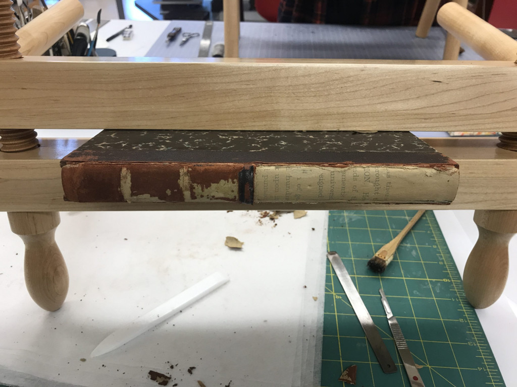 book in press with the spine removed