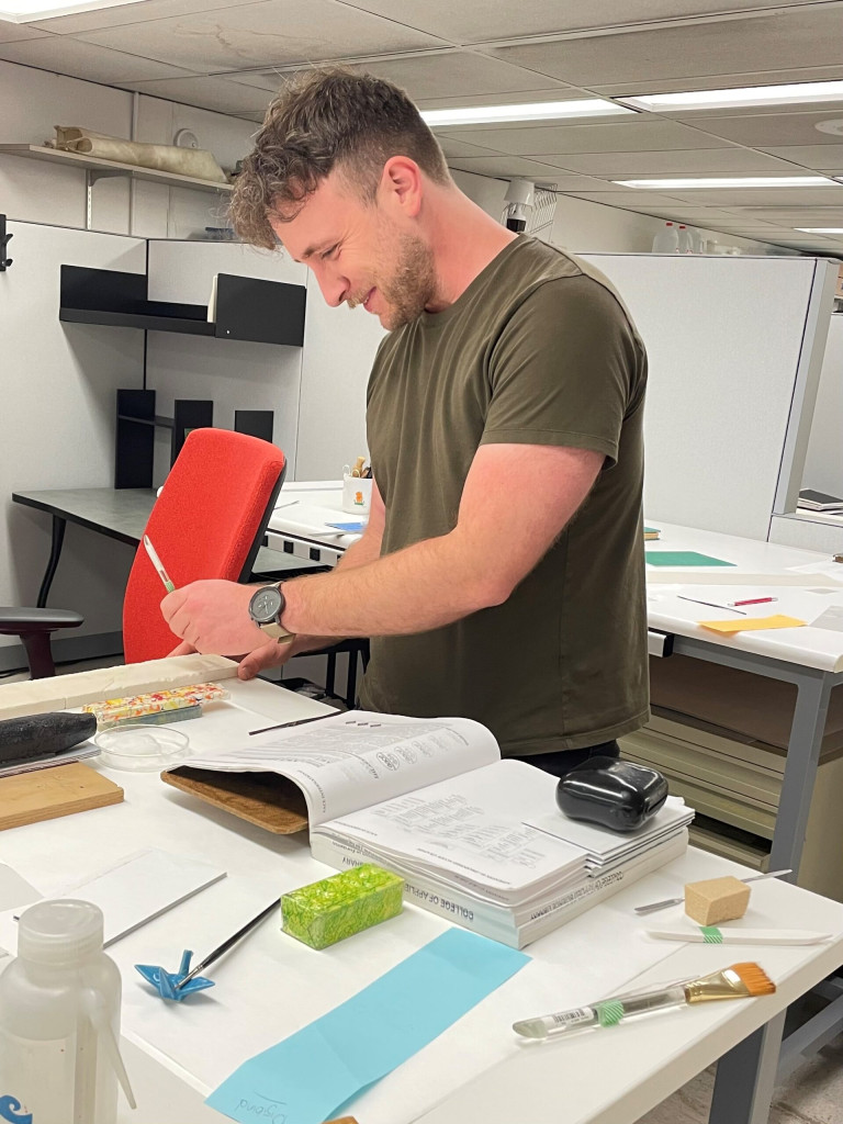 Photo of Matt working on a general collections repair