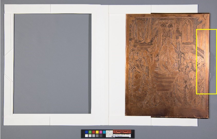 Copper plate partially removed from the matting system with a box highlighting the location of the polyester film tray