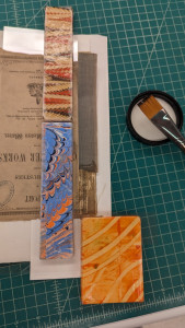 General collections treatment removing a cloth spine hinge with a methyl cellulose poultice.