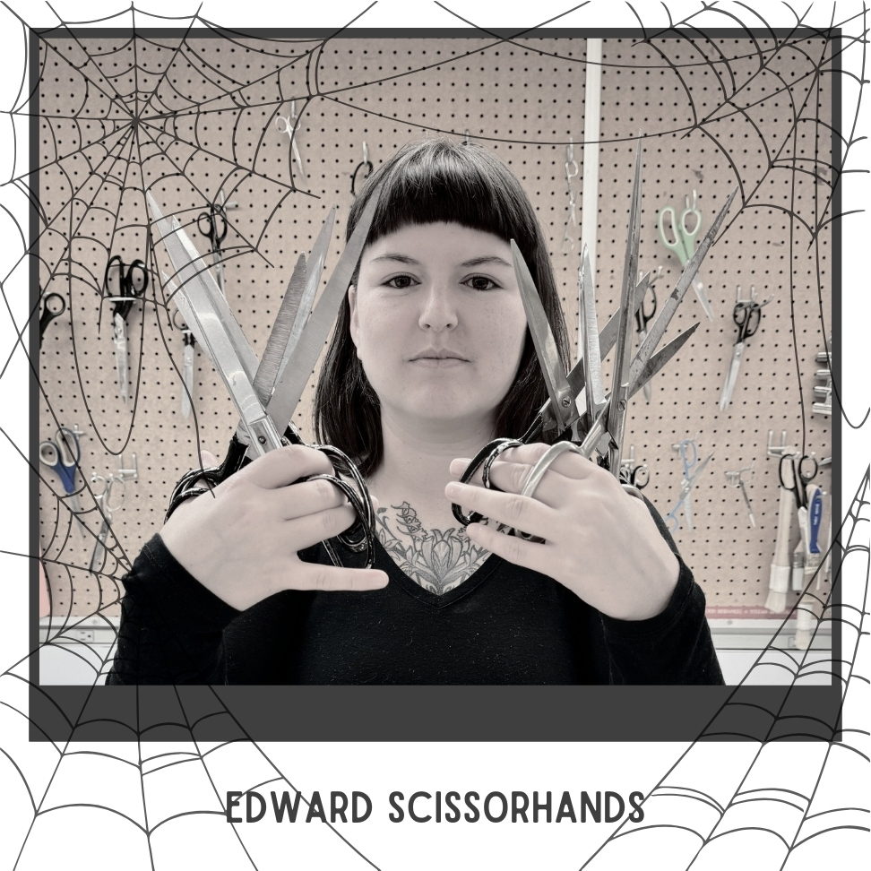 Edward Scissorhands costume, woman in black holding many scissors