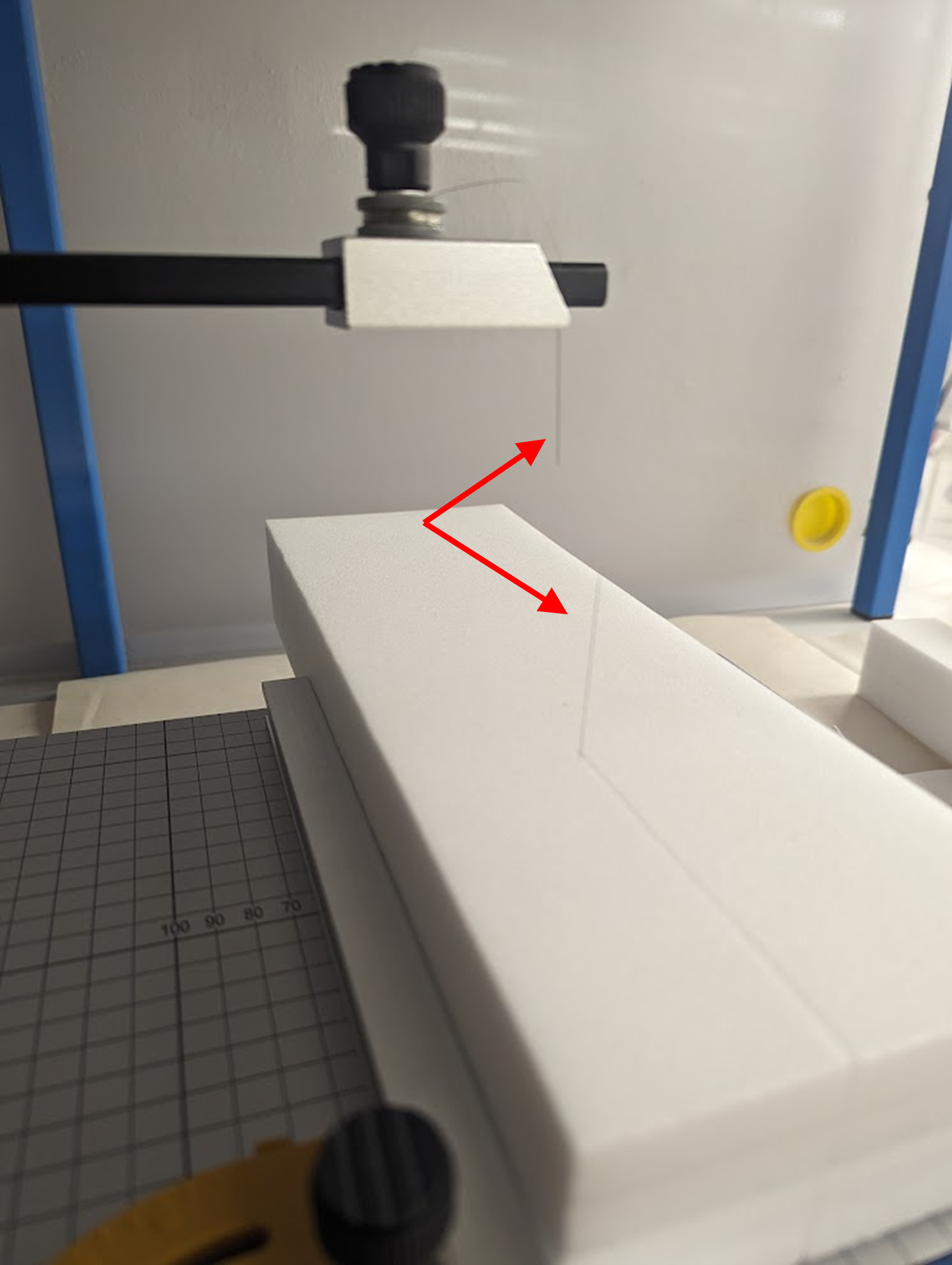 Image of a snapped cutting wire caused by applying to much pressure, and not enough heat, while cutting a foam block.