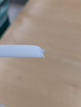 Image of foam with rough edge from being cut on a board shear.