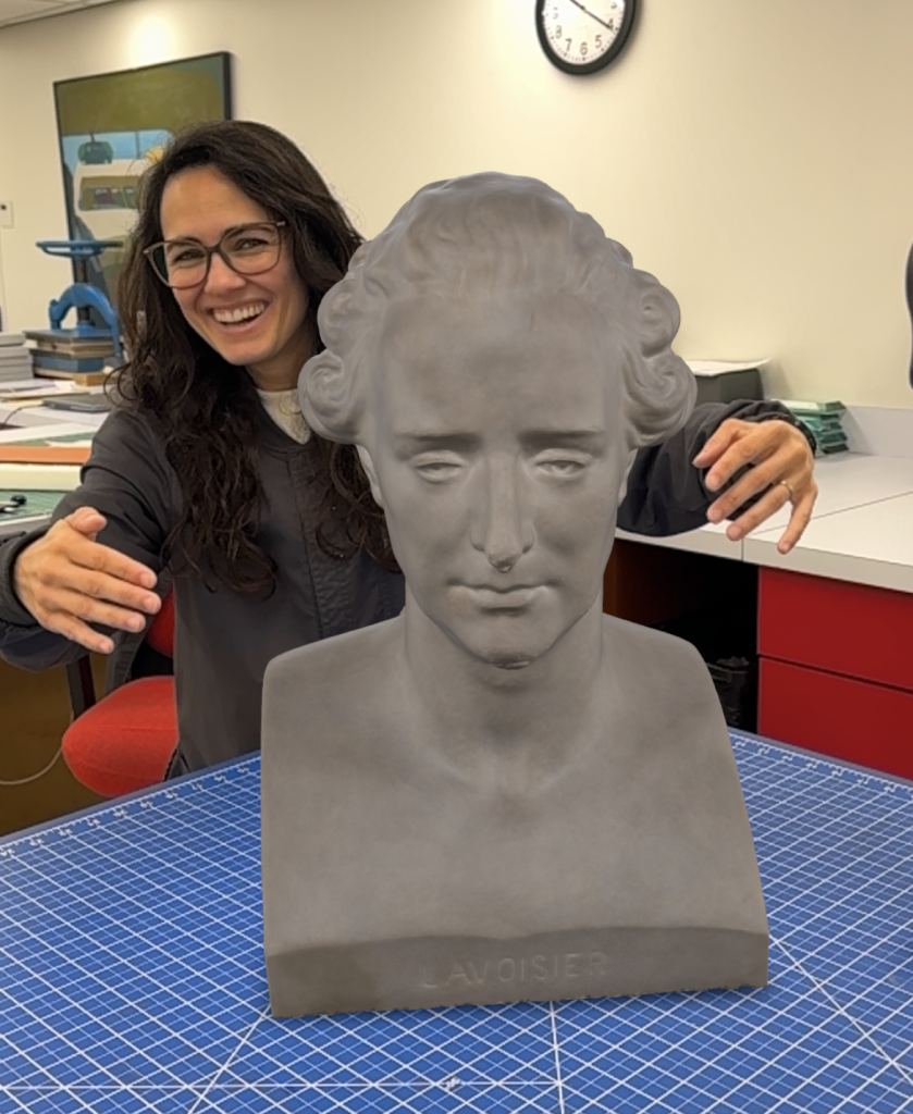 Woman attempting to hug a 3D model of Antoine Lavoisier (bust).
