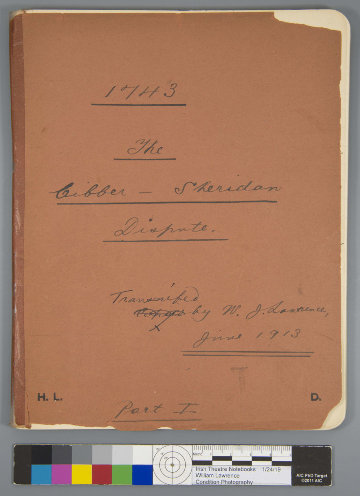 Overhead of a notebook  with tape along the spine.