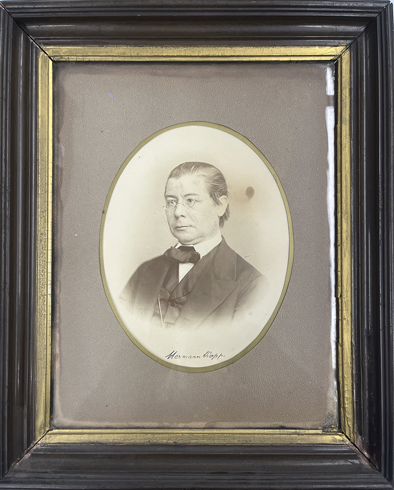Framed black and white photograph of a man in a suit