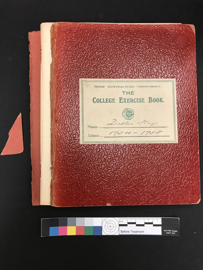 Overhead of a notebook with a torn cover.