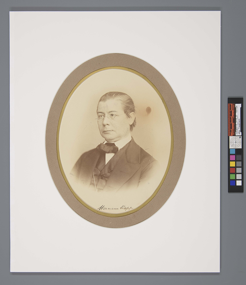 Overhead view of the photograph with a white mat board window.