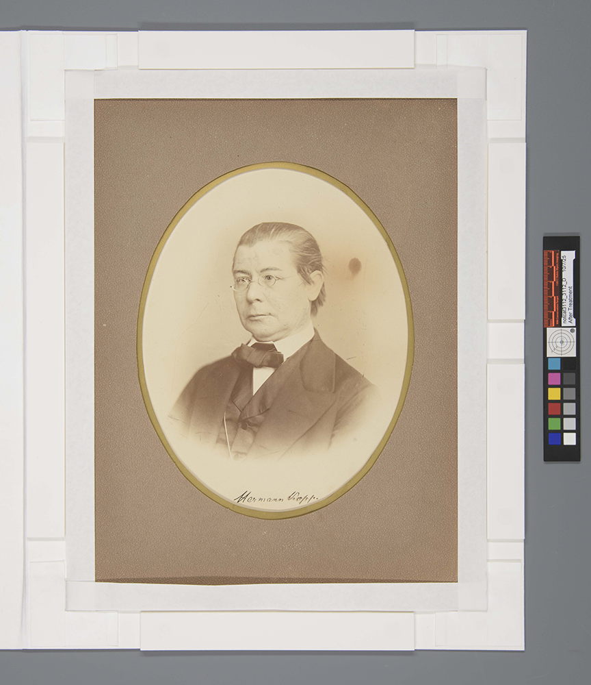 Overhead view of the photograph with the window of the matting system open to show the paper cradle in place.