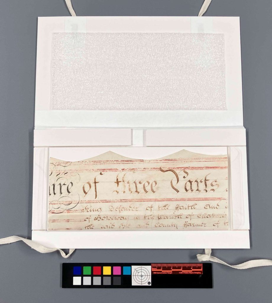 Small sink mat model with a parchment document fragment inside.