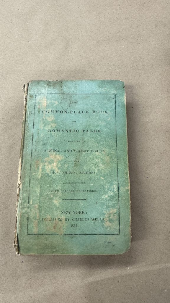 Example of an extra boarded binding with glazed paper covering the boards and printed text on the front cover.