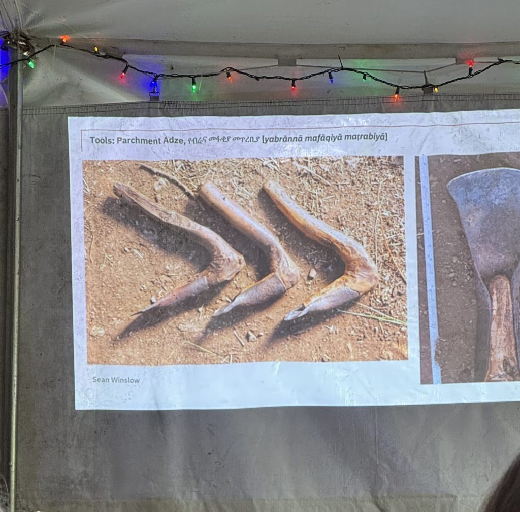 A photo of a presentation slide show three Ethiopian parchment tools.