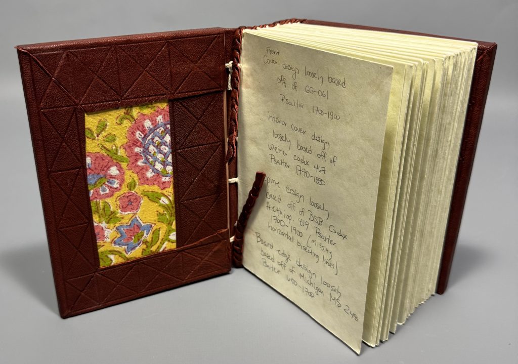 Leather bound book with blind tooling on the turn-ins and leather patch.
