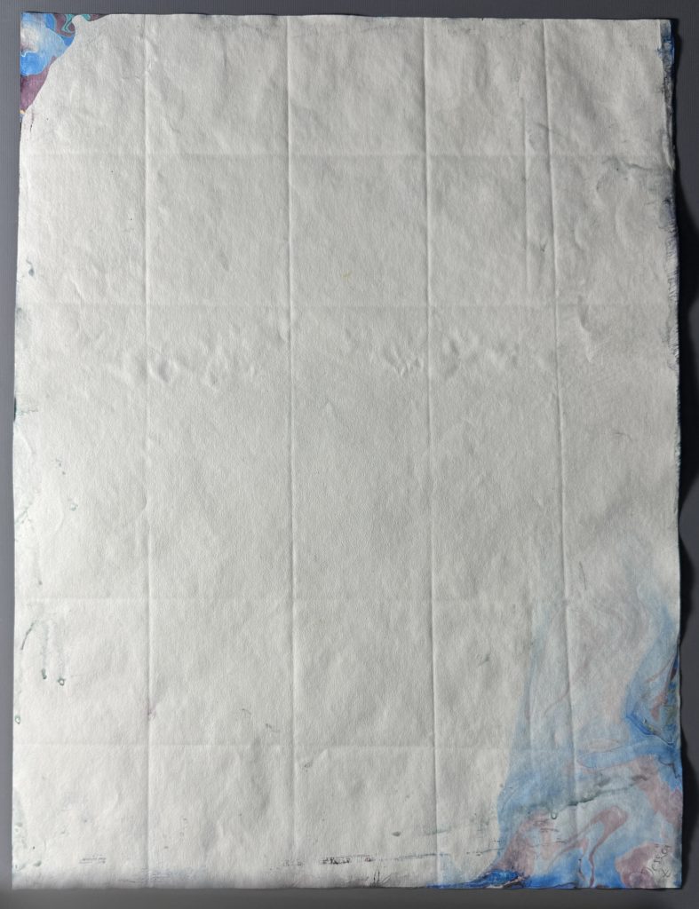 Reverse of the moire Spanish wave under raking light to show how the paper was folded prior to pulling the sheet.